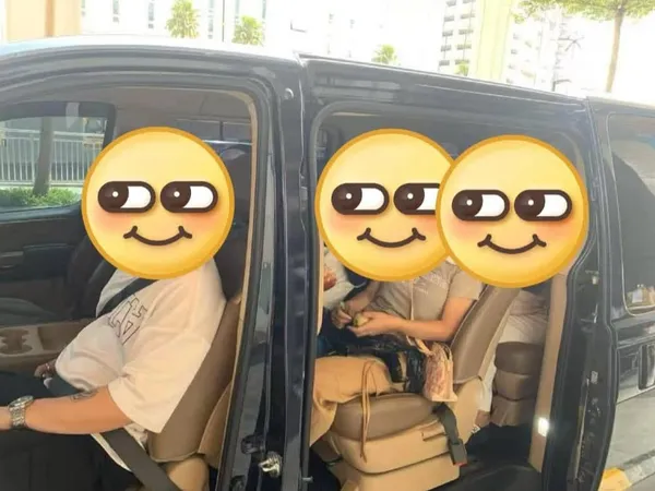 Customers seated inside a black MPV with the doors open