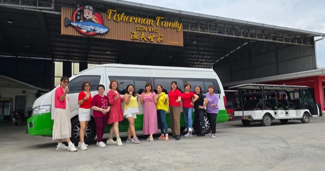 A group of customers with their chauffeur van outside Fisherman Family restaurant in Malaysia