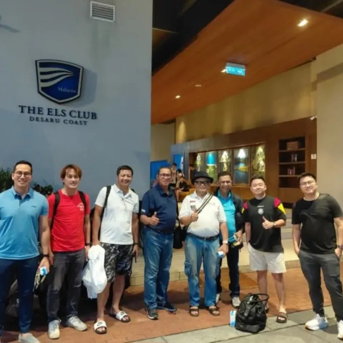 A group of men posing outside The Els Club Desaru Coast