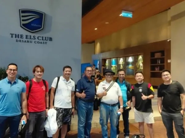 A group of men posing outside The Els Club Desaru Coast